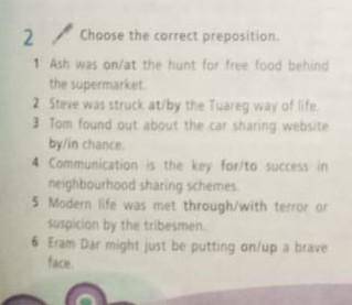 Choose the correct preposition 1) Ash was on/at the hunt for free food behind the supermarket.​