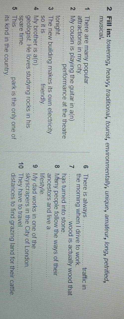 2 Fill in: towering, heavy, traditional, tourist, environmentally, unique, amateur, long, petrified,